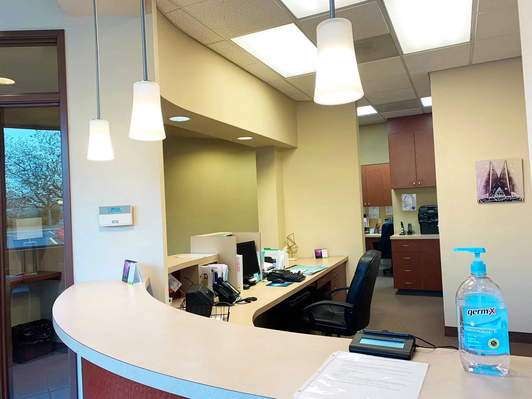 Modern dental treatment room with patient chair and overhead light